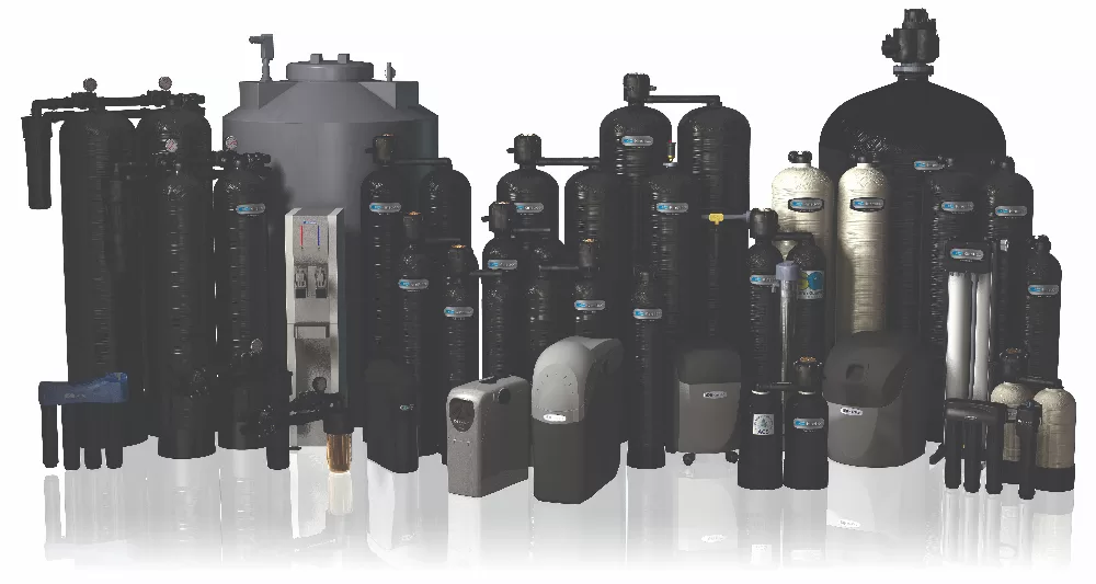 Various Kinetico water treatment systems displayed together in a group.